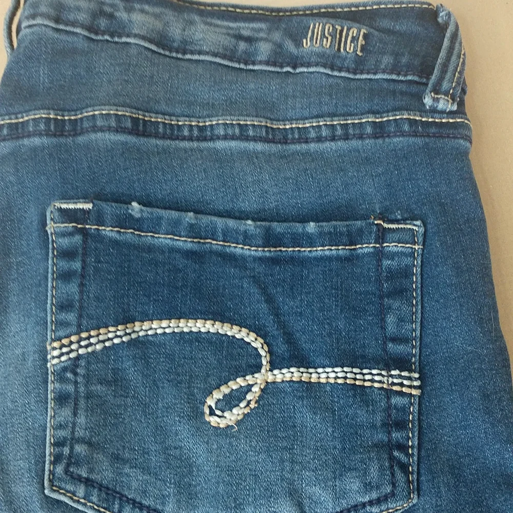 Justice mid rise skinny jeans. Size 16 plus
